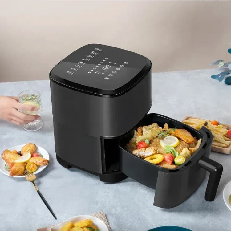 black 3.5 L air fryer with the basket open and fried food