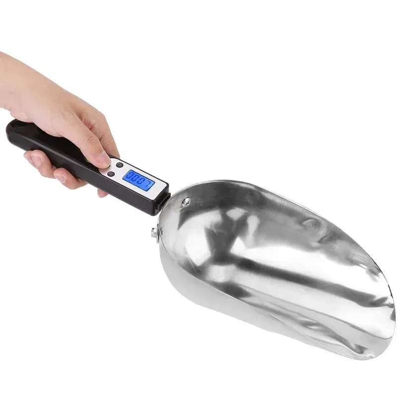 digital scoop scale with stainless steel scoop held in hand