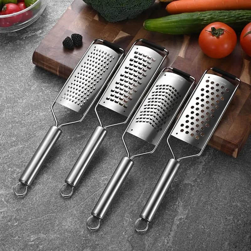 four stainless steel handheld graters with different plates